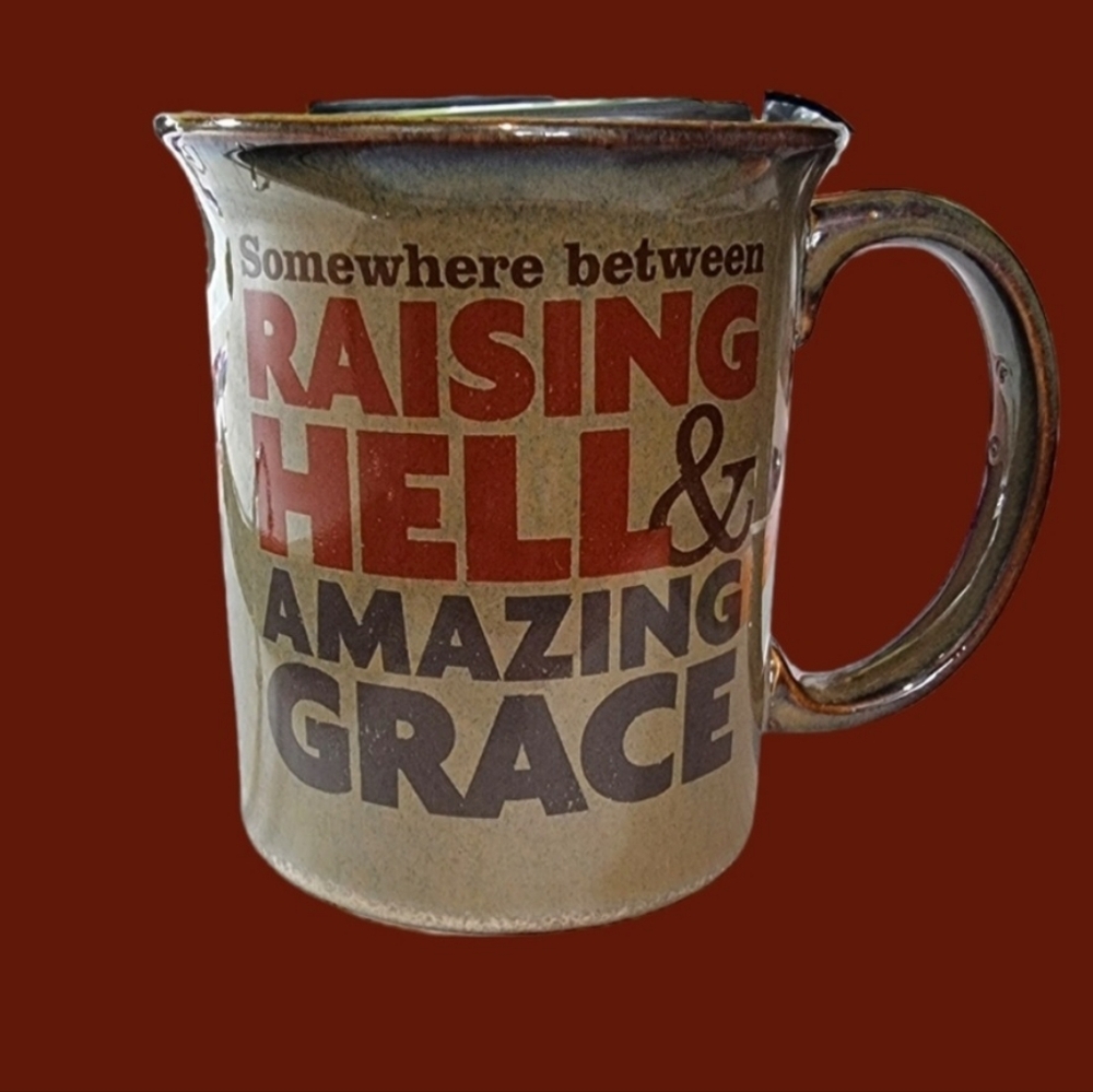 Hallmark Mug Somewhere Between Raising Hell & Amazing Grace.